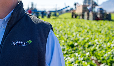 AgWest Logo on a jacket in a field