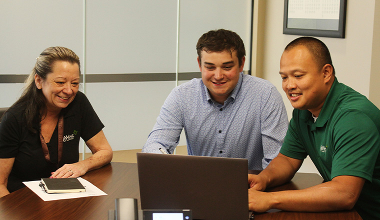 employees around a computer